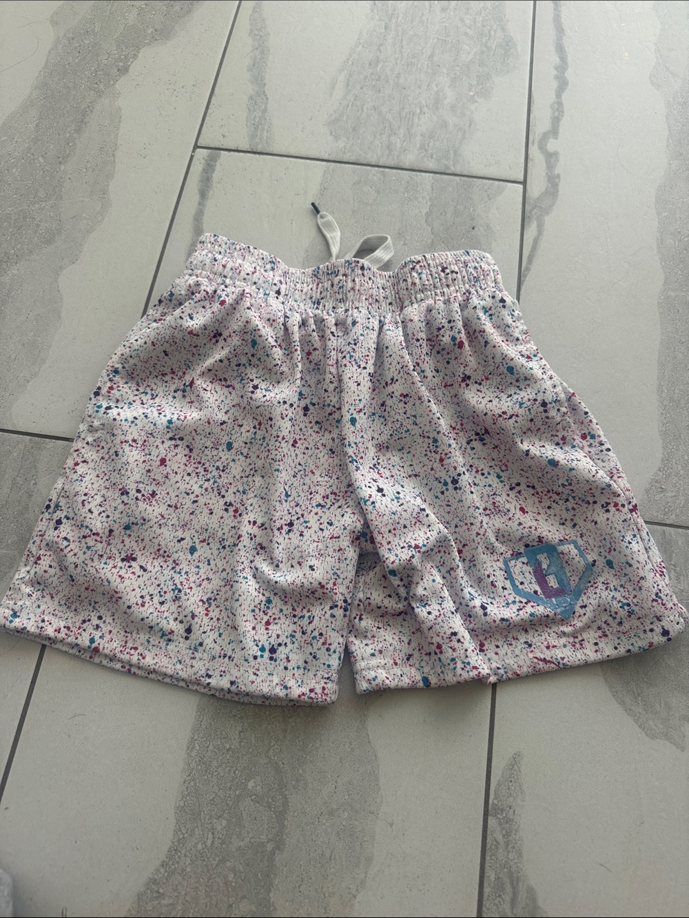 Kids White Speckled Drawstring Athletic Shorts with Blue Accent